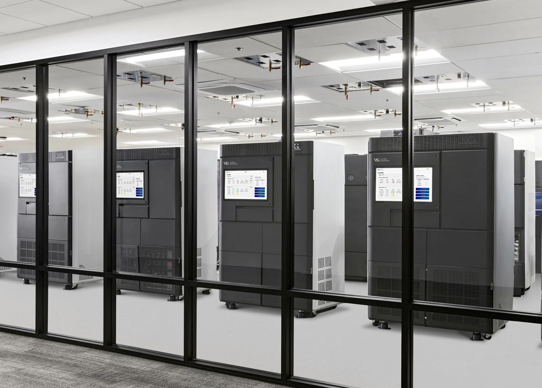 Ultima Genomics sequencing systems behind glass in a laboratory